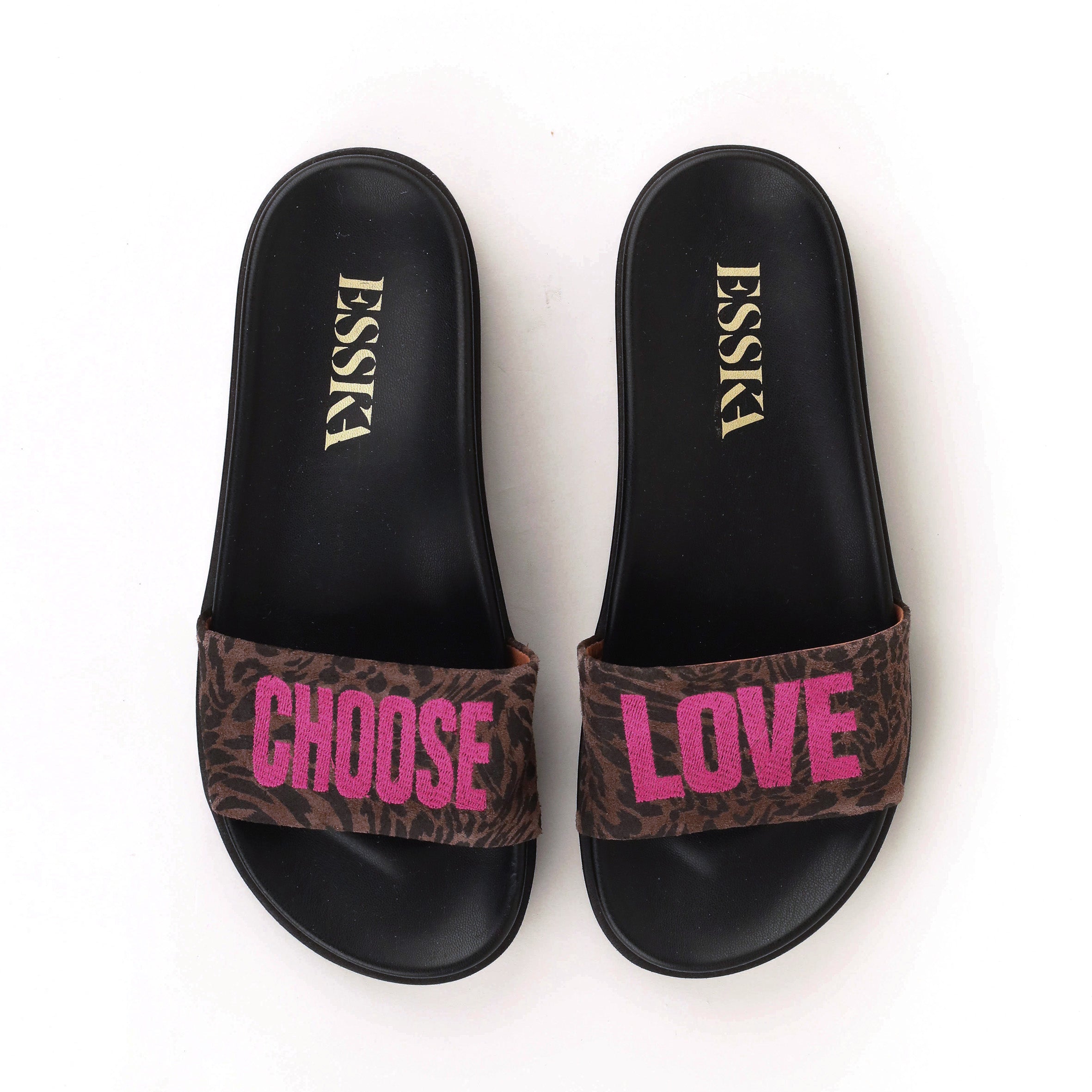 Pair of slides with leopard print straps displaying 'CHOOSE LOVE' on a white background.